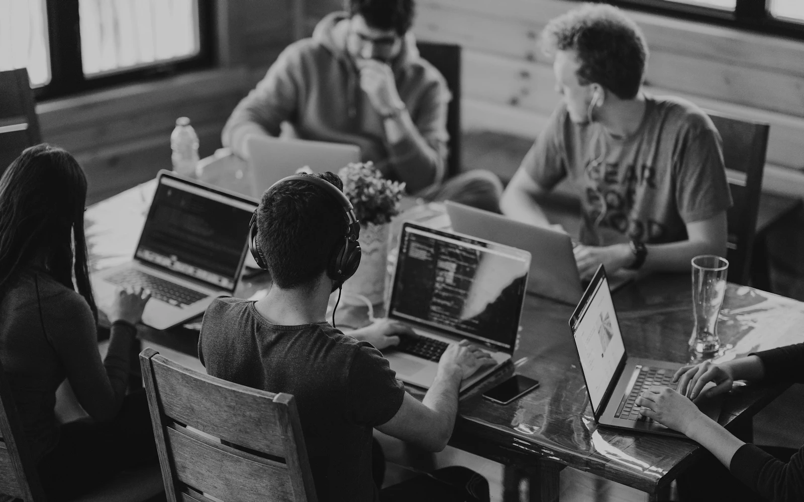 A team working together around laptops